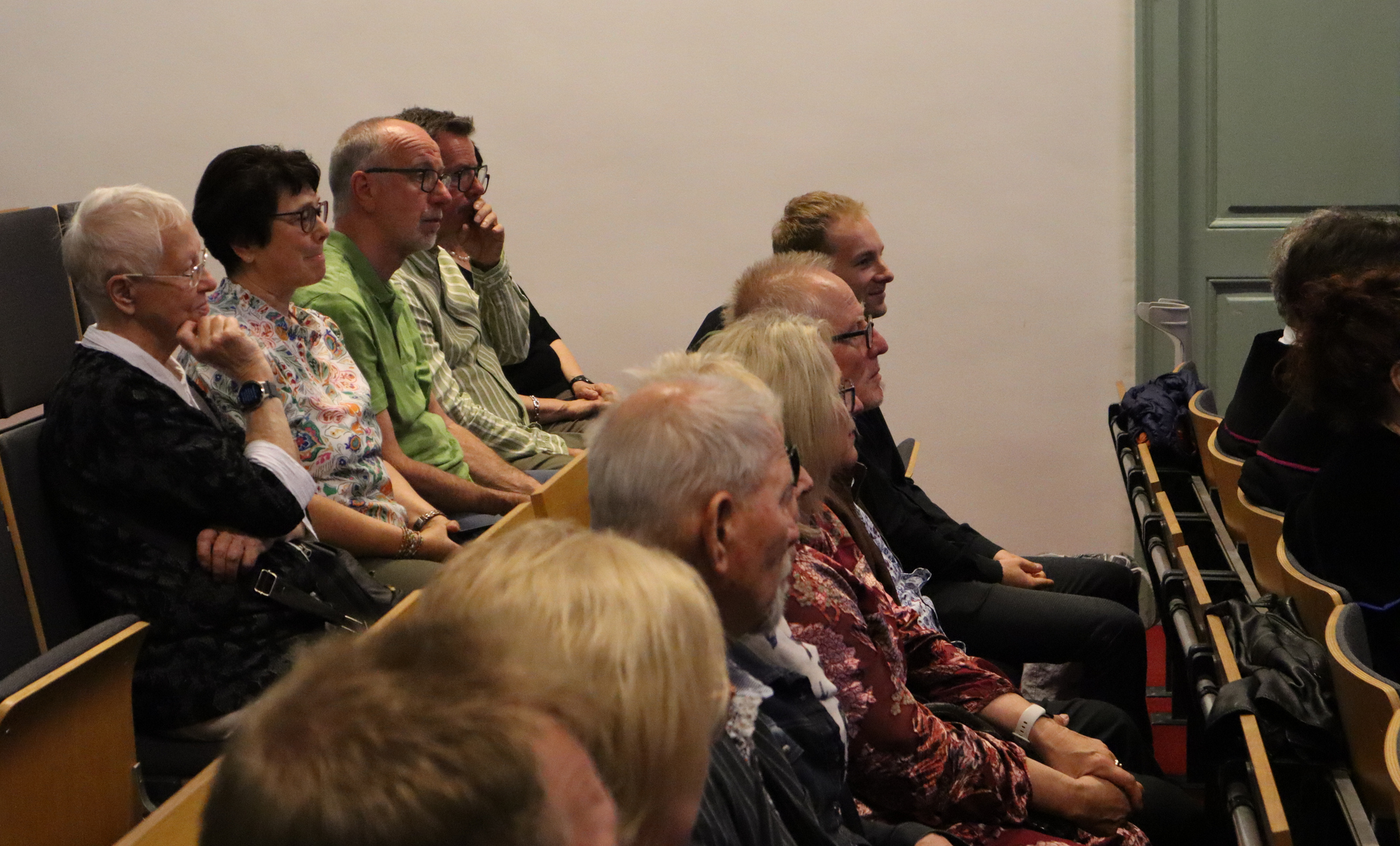 While the audience patiently listened, …